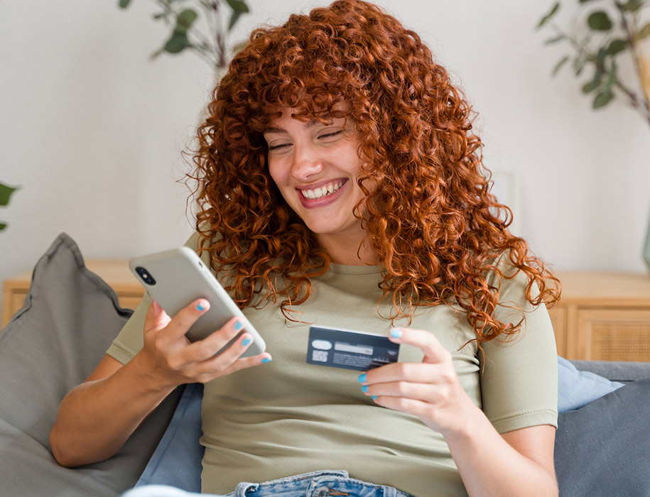a woman making a debit/credit card purchase