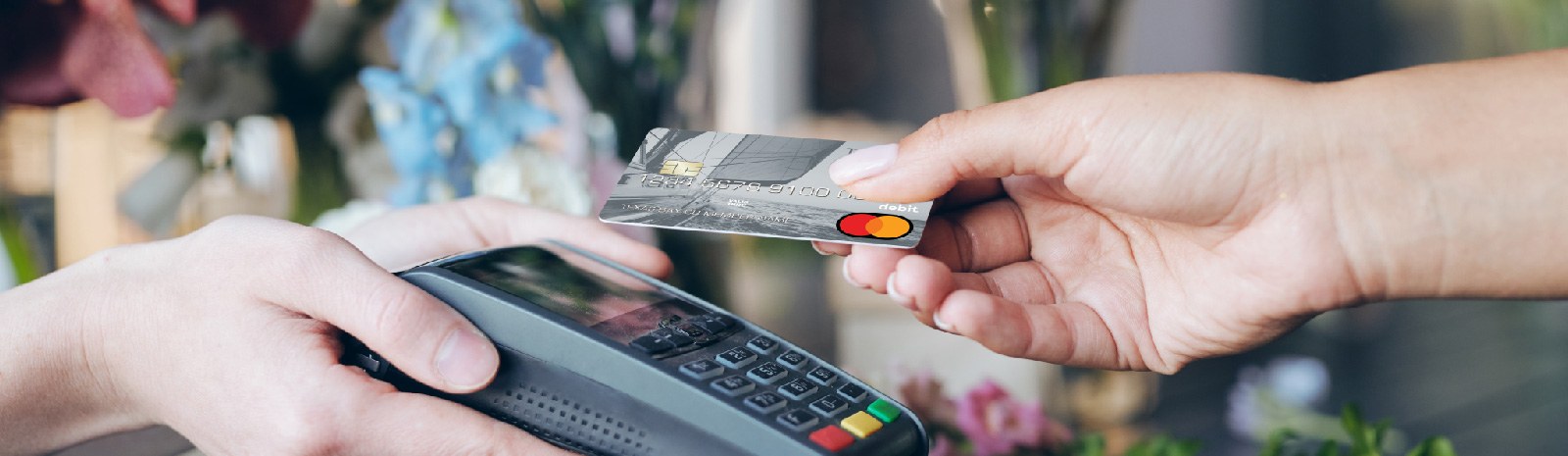 a person making a credit/debit card purchase