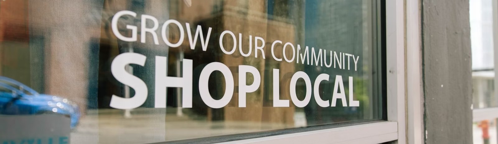 grow our community shop local store signage